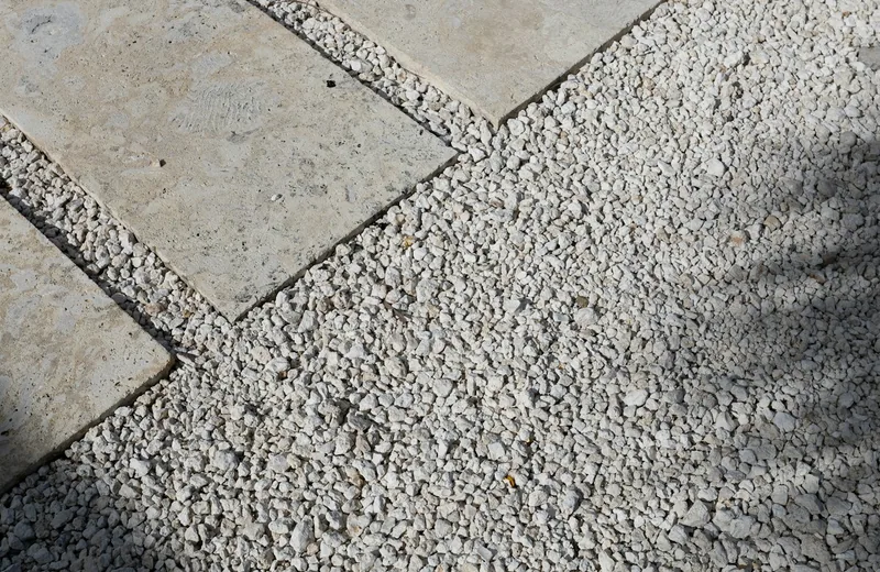Stone paving slabs set into a gravel pathway